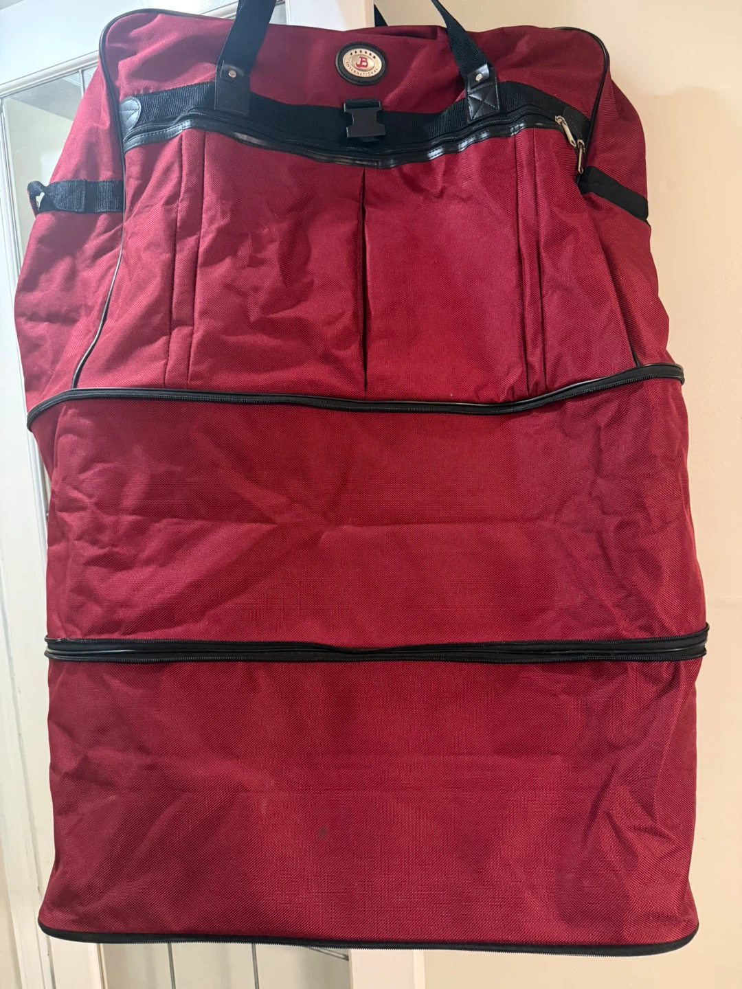 Large Red Rolling Luggage Bag