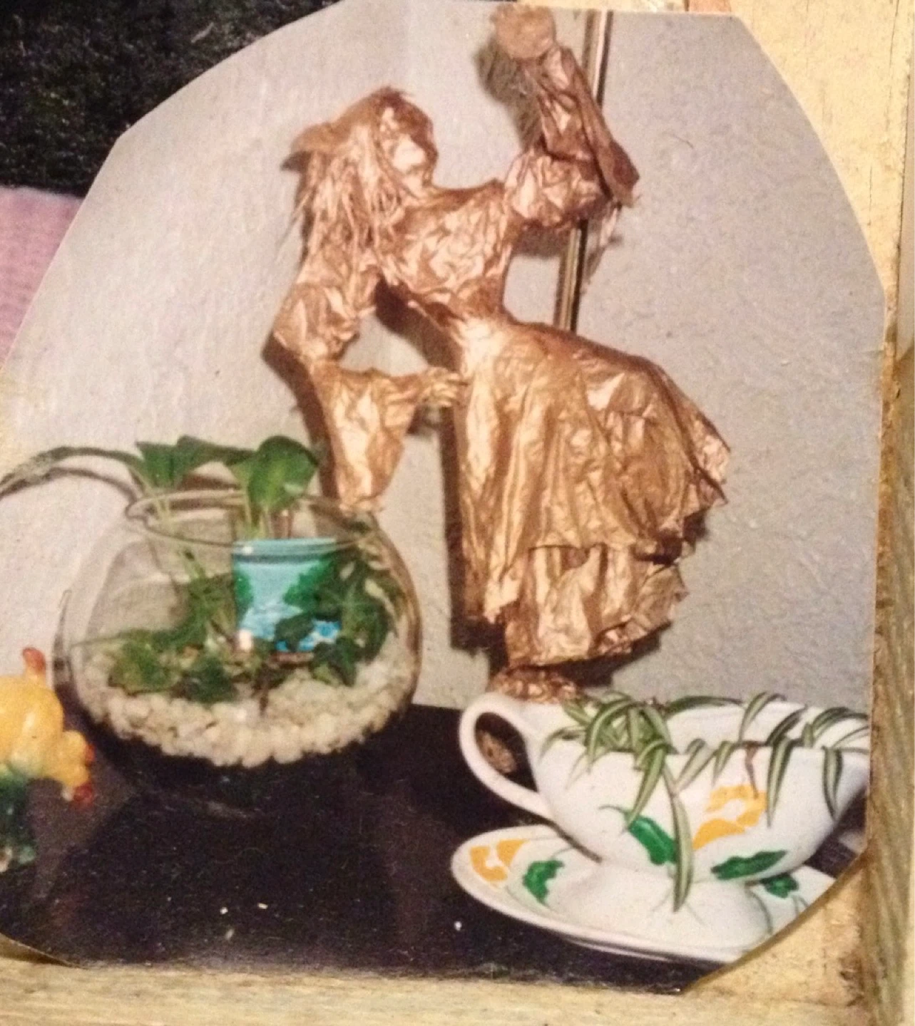 Gold Figure with Plants Display
