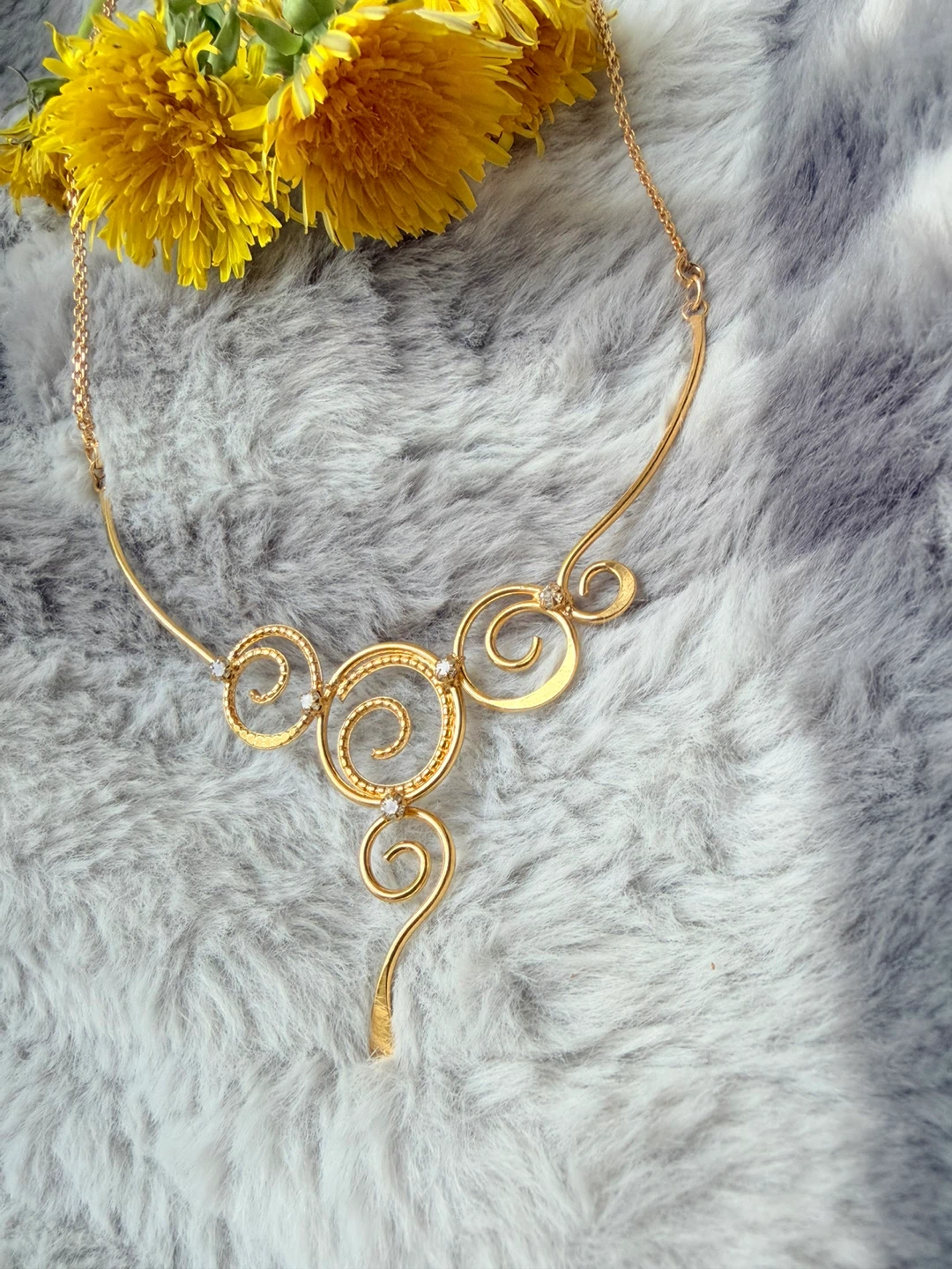 Gold-tone Swirl Necklace with Accent Crystals