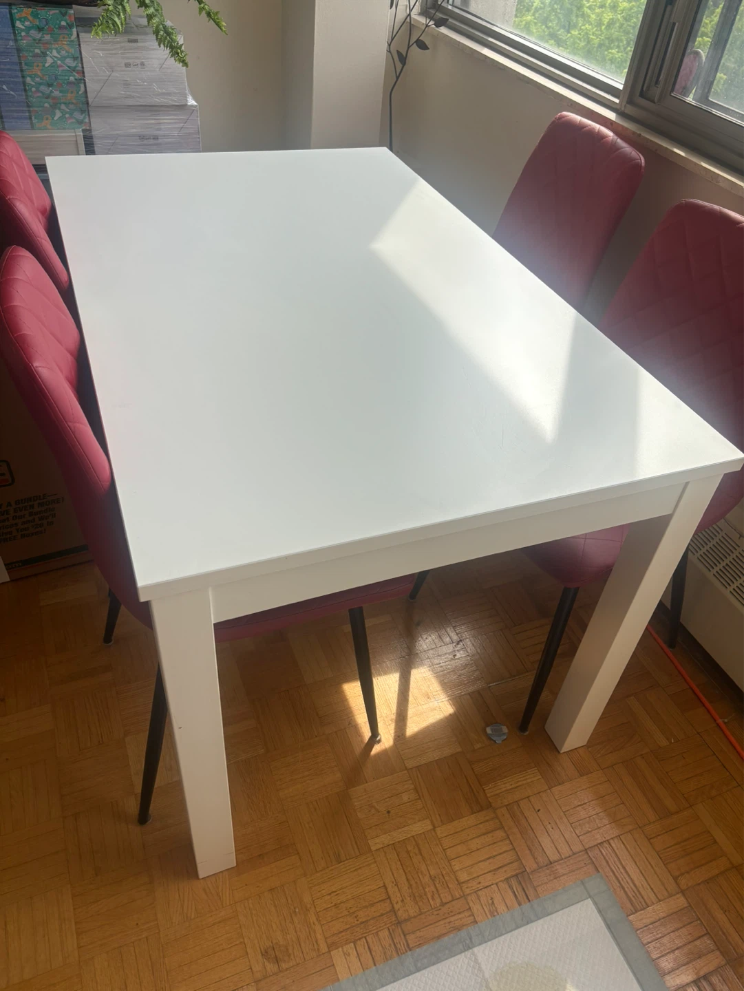 White Dining Table with Red Chairs