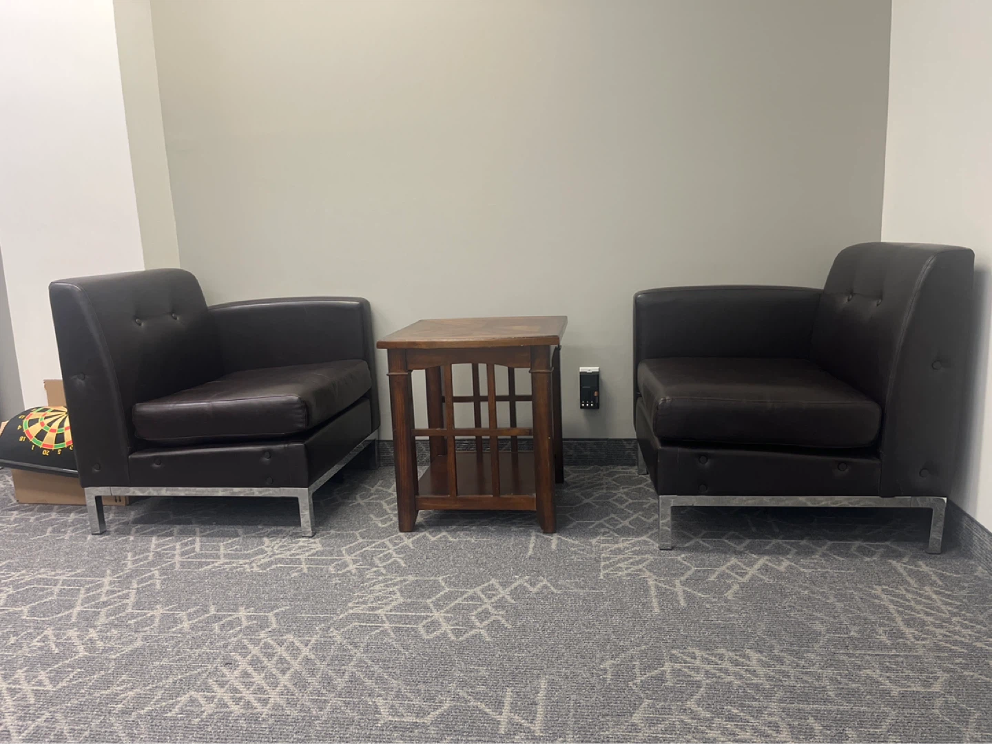 Single seat couch pair with a wooden coffee table