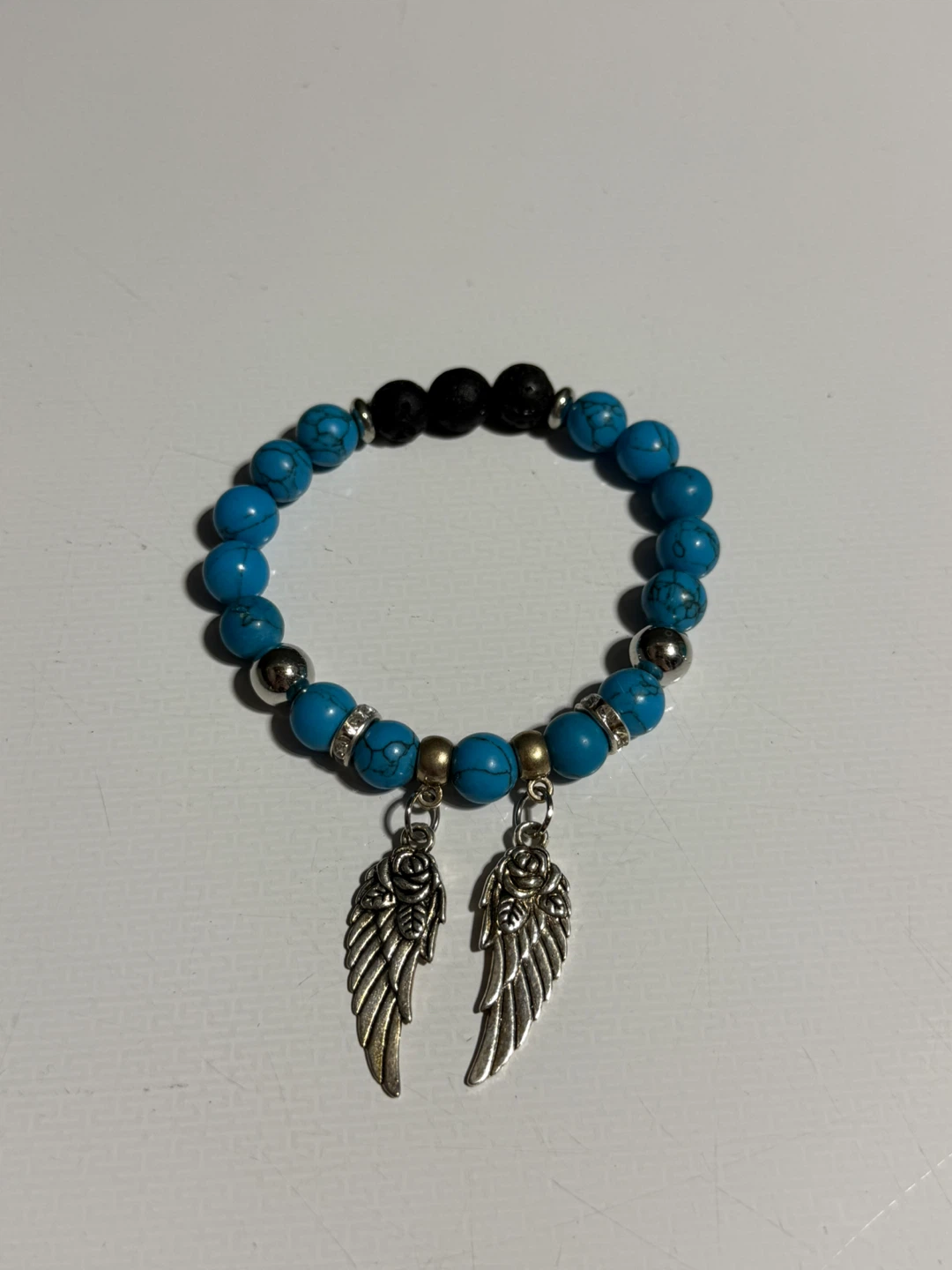 Turquoise Beaded Bracelet With Angel Wing Charms