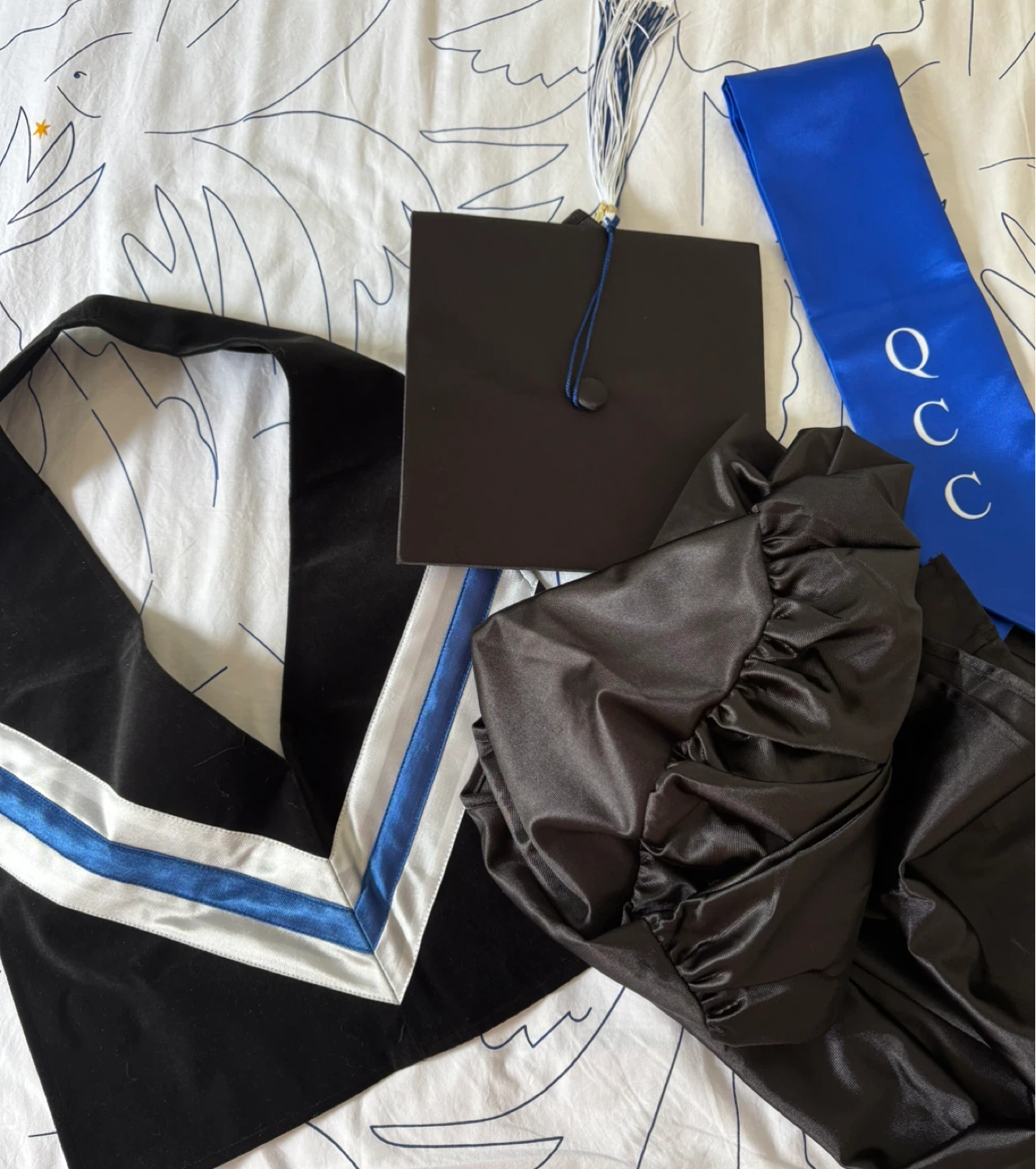 Queensborough Community College graduation cap and gown