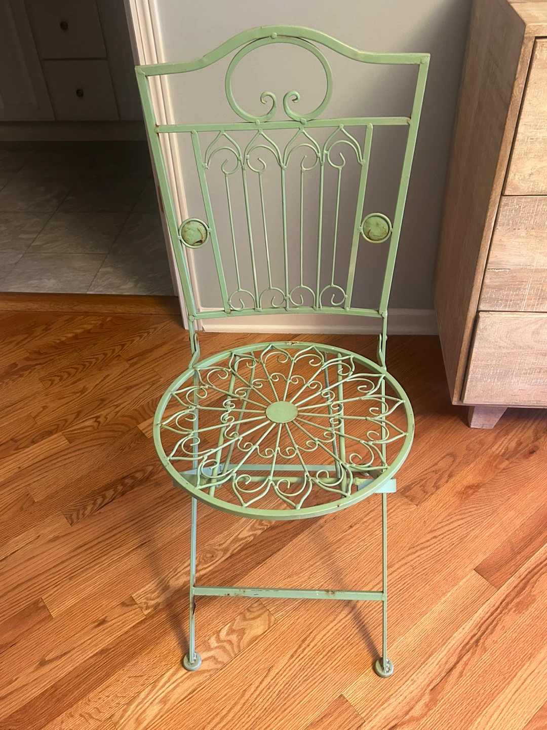 Green Metal Folding Chair with Scrollwork