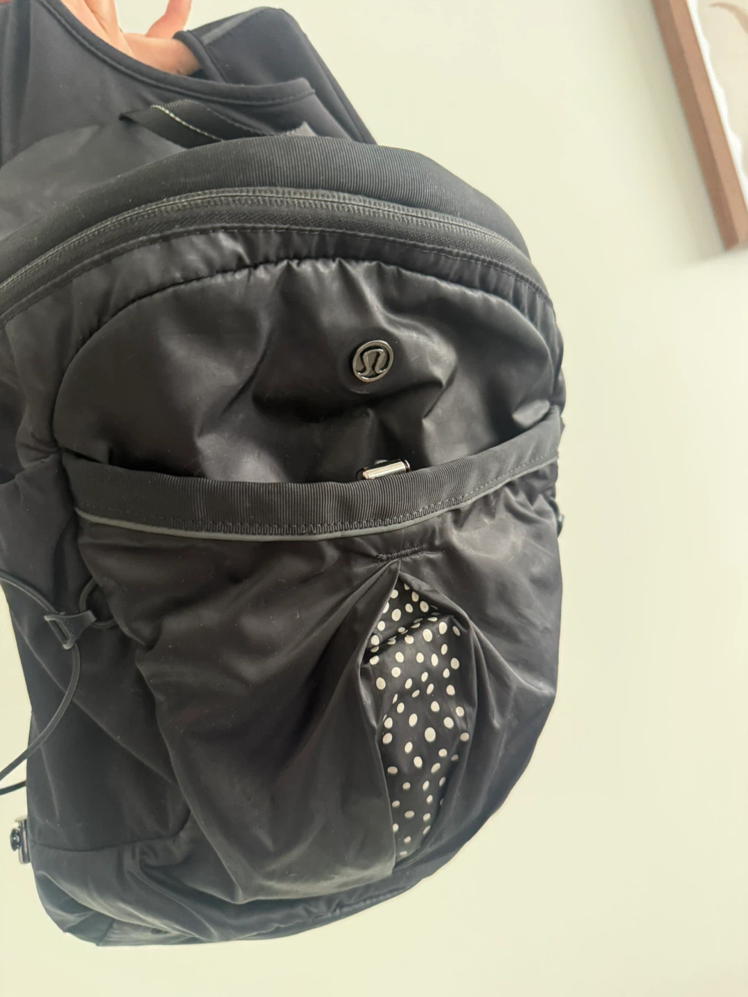Lululemon Black Sling Backpack with Polka Dot Detail