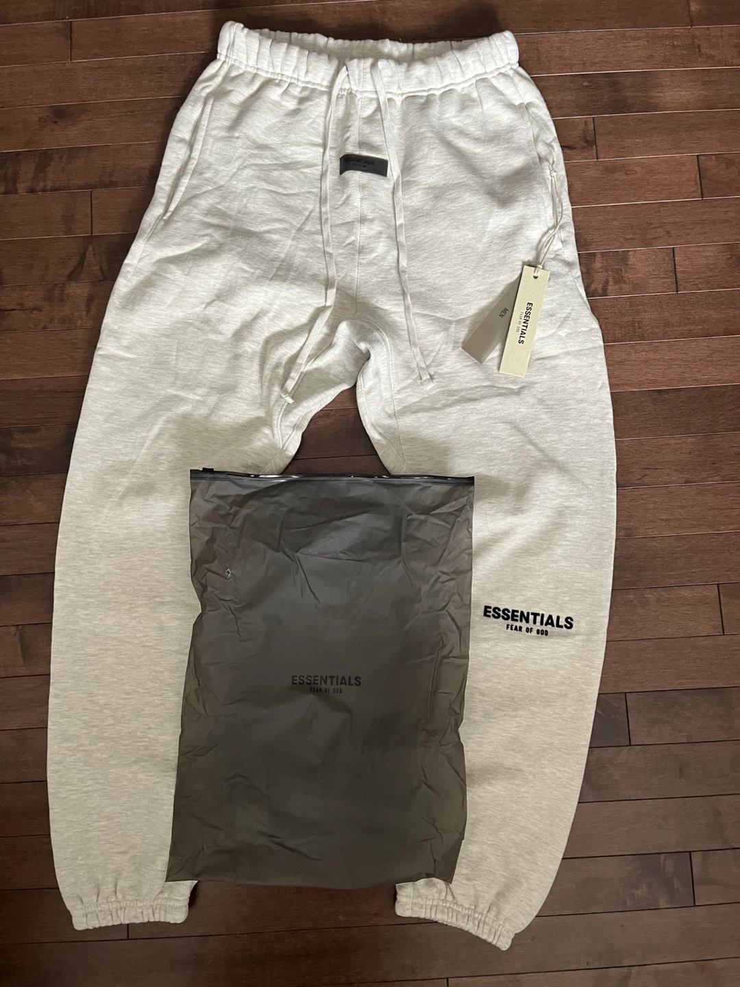 ESSENTIALS Fear of God Sweatpants Light Oatmeal. Cuffed