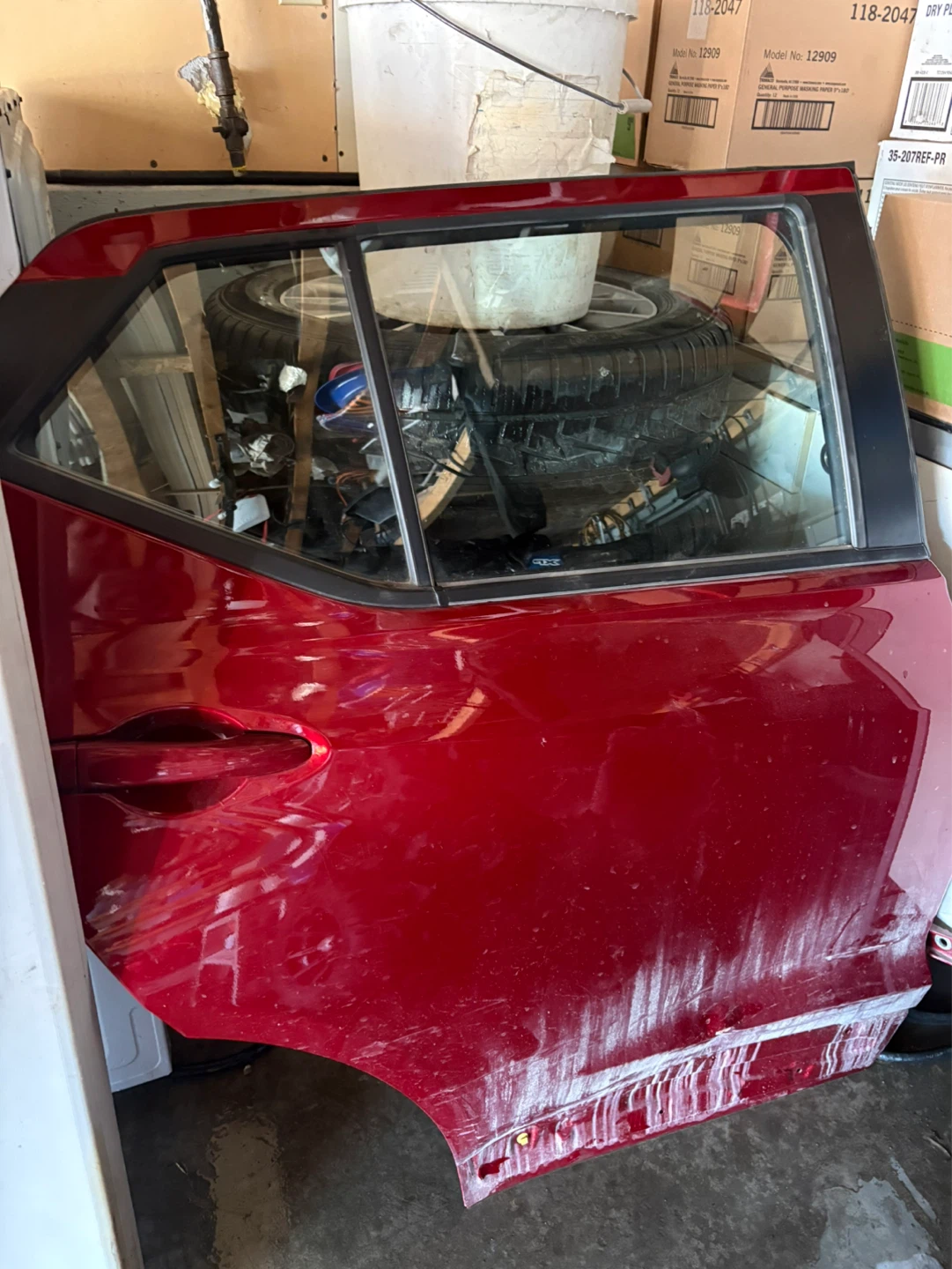 Red Car Door and Pair of Front Seats