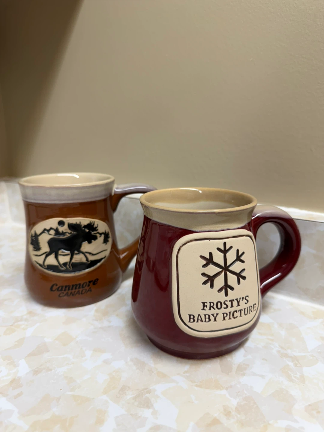 Two "Frosty's Baby Picture" and "Canmore Canada" Mugs