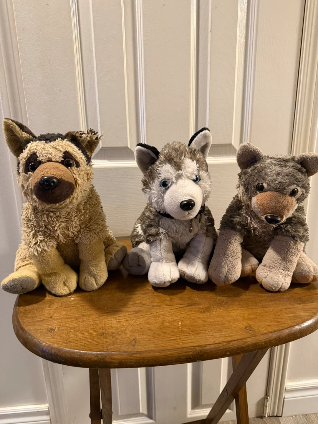 Three stuffed dog plush toys