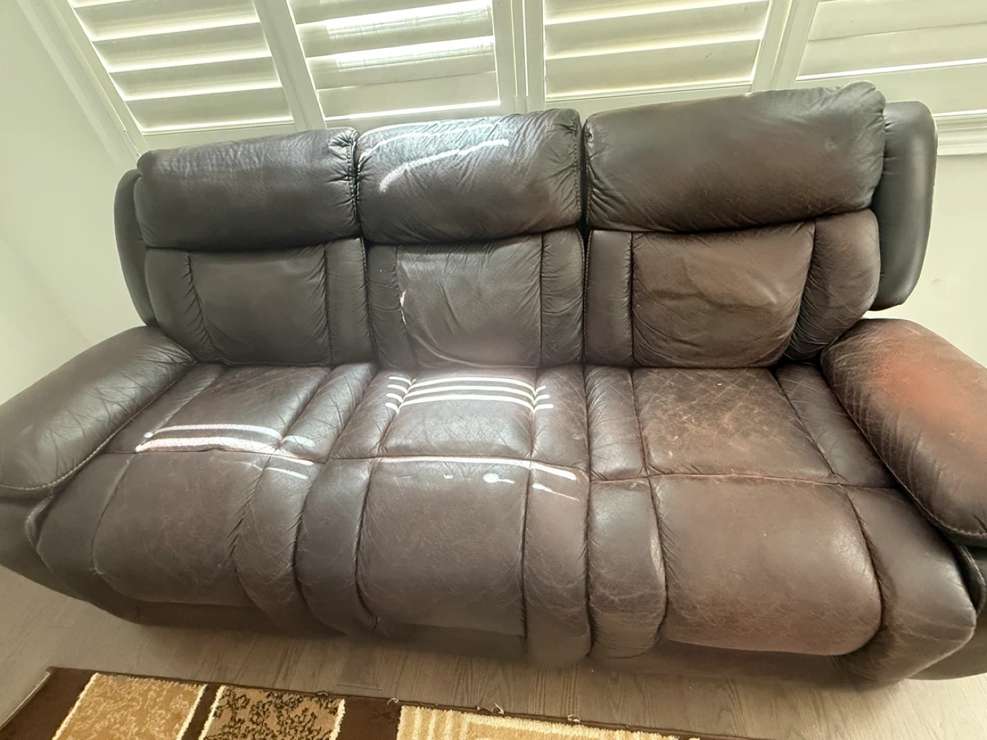 Brown Leather Reclining Loveseat with Cup Holders