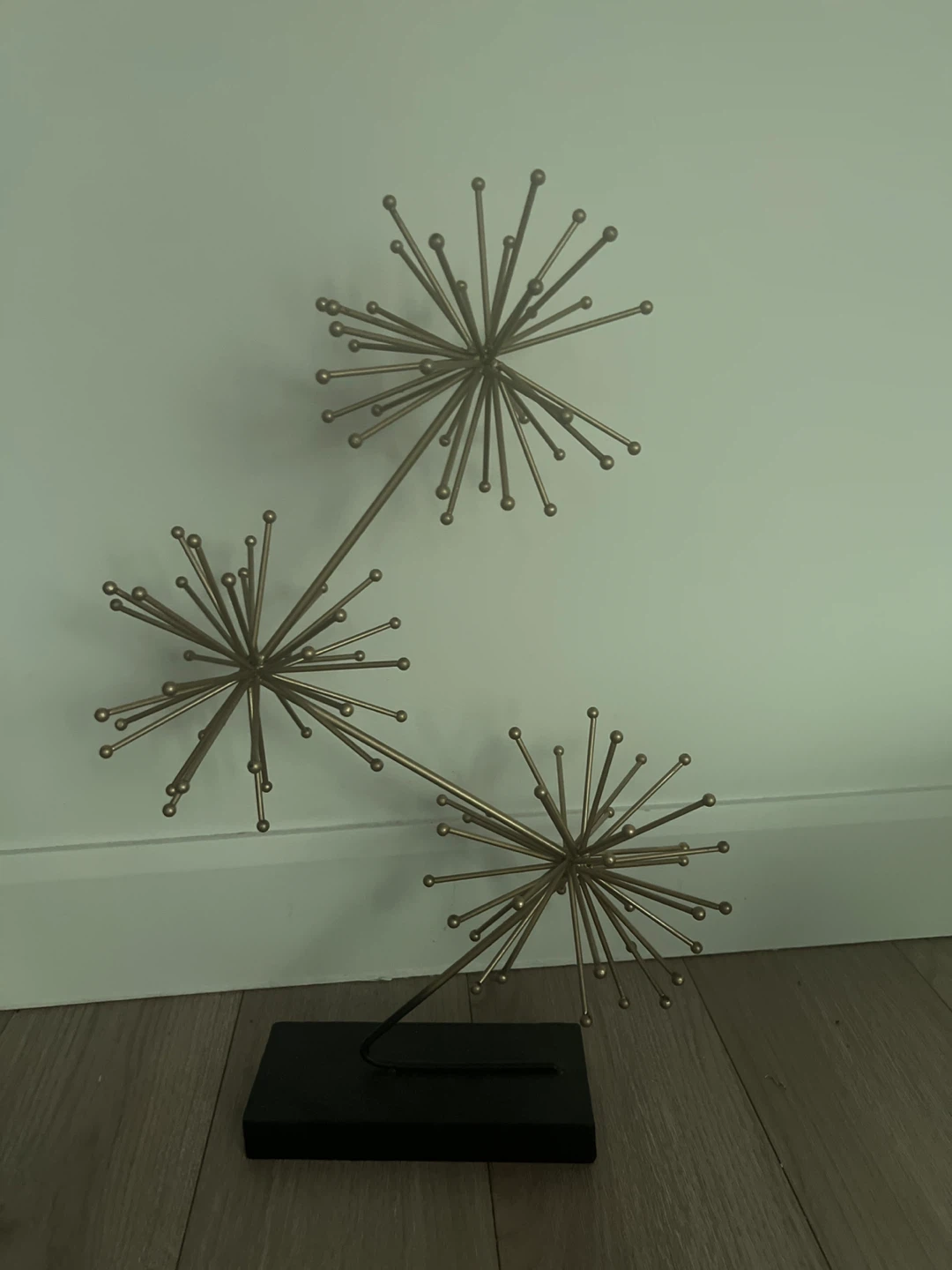 Gold Starburst Sculpture on Black Base