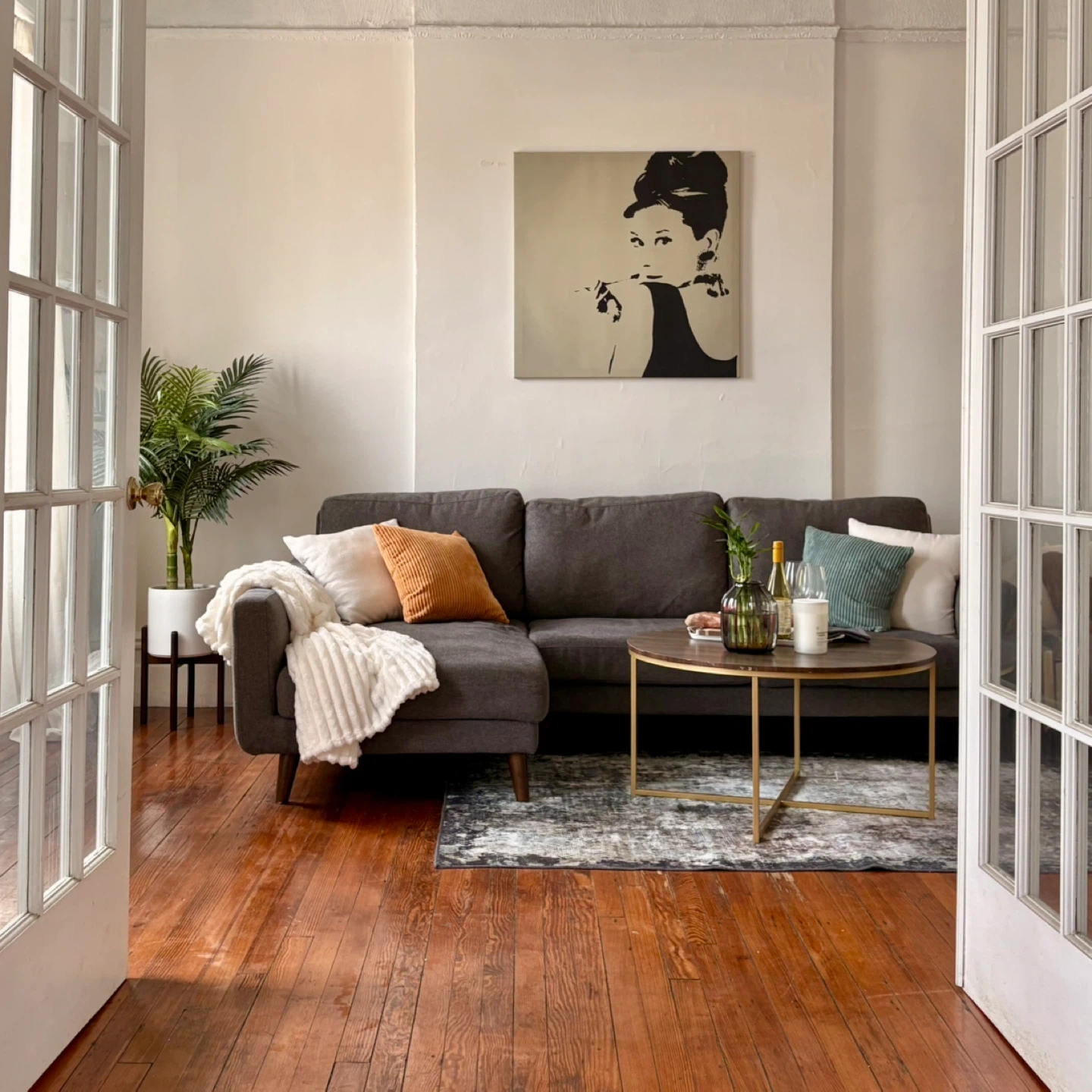 Gray Sectional Sofa and Gold Coffee Table