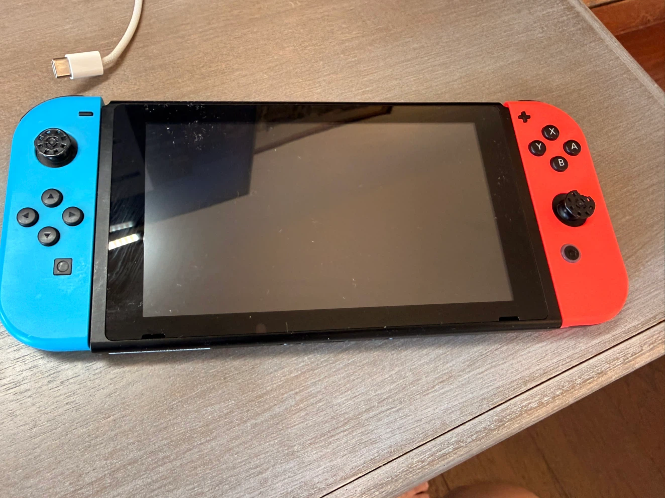 Nintendo Switch Console with Neon Blue and Red Joy-Cons