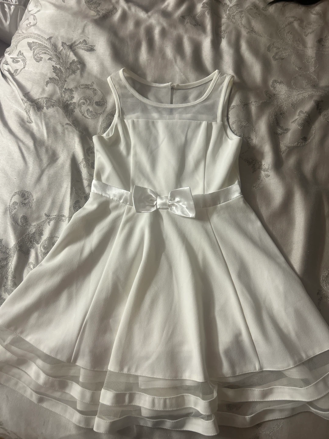 White sleeveless dress with bow