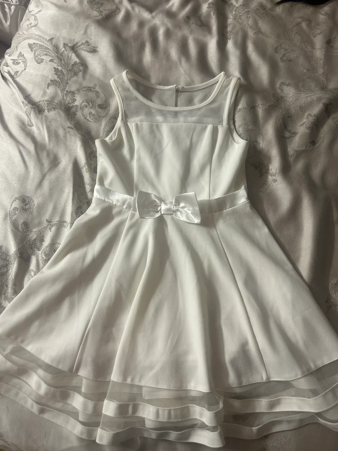 White sleeveless dress with bow