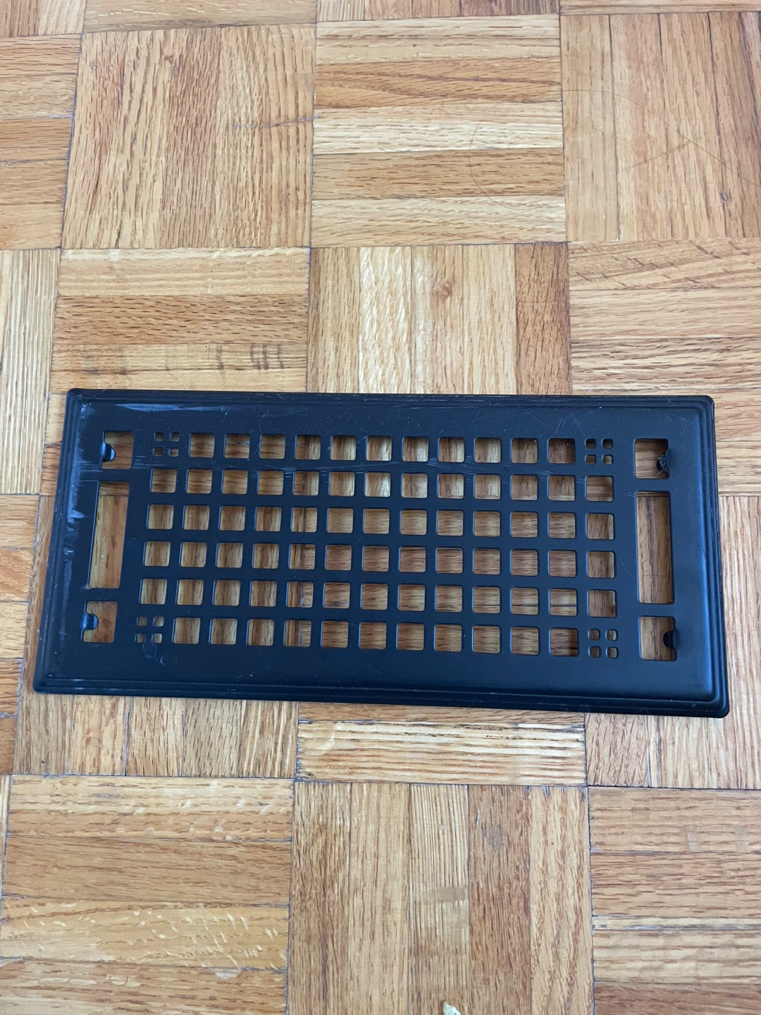 Black metal vent cover