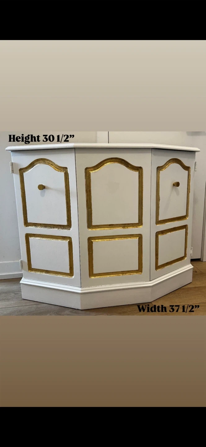 White corner cabinet with gold trim