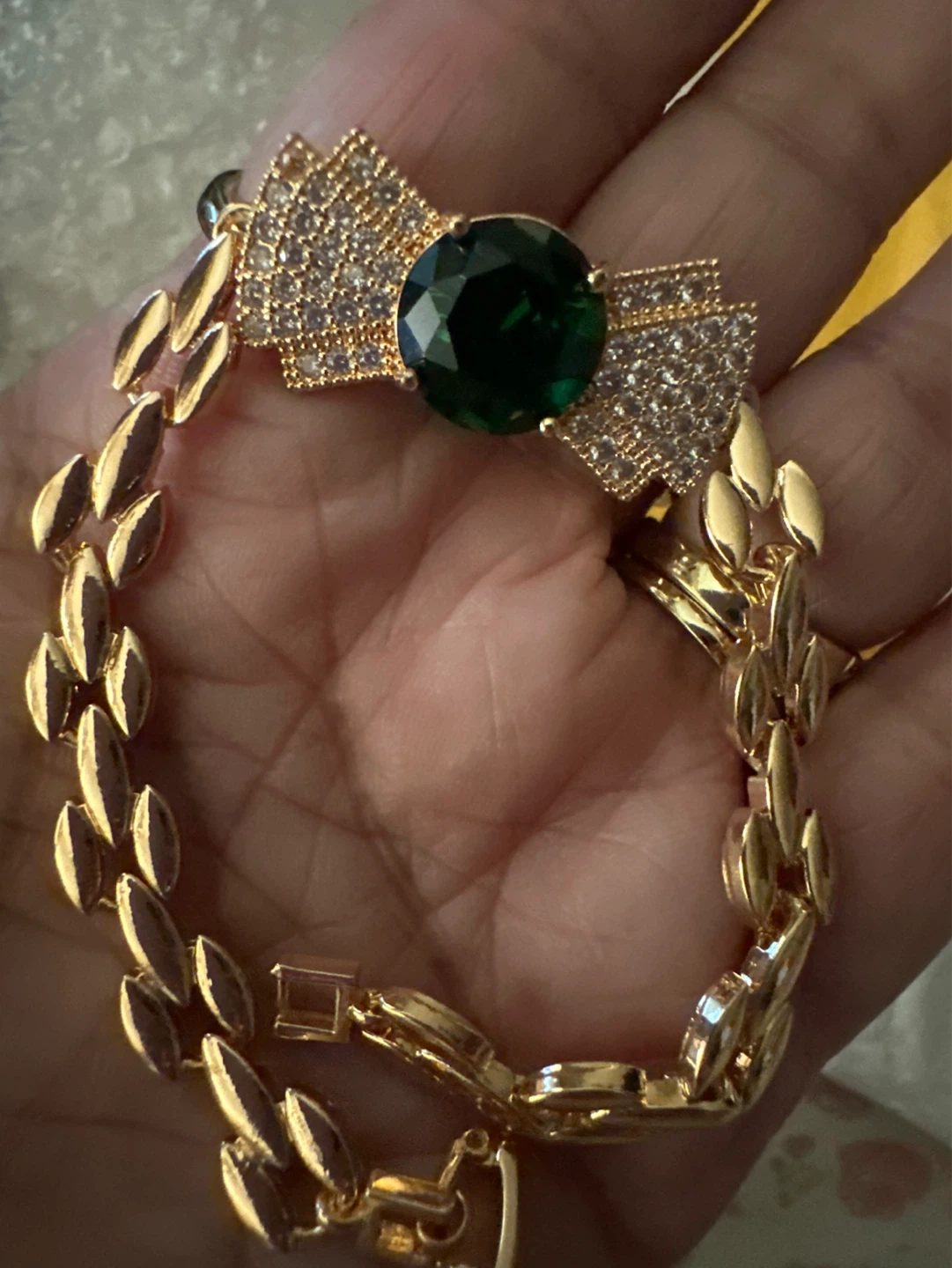 Gold Tone Bracelet with Green Emerald-like Stone and Crystal Bow