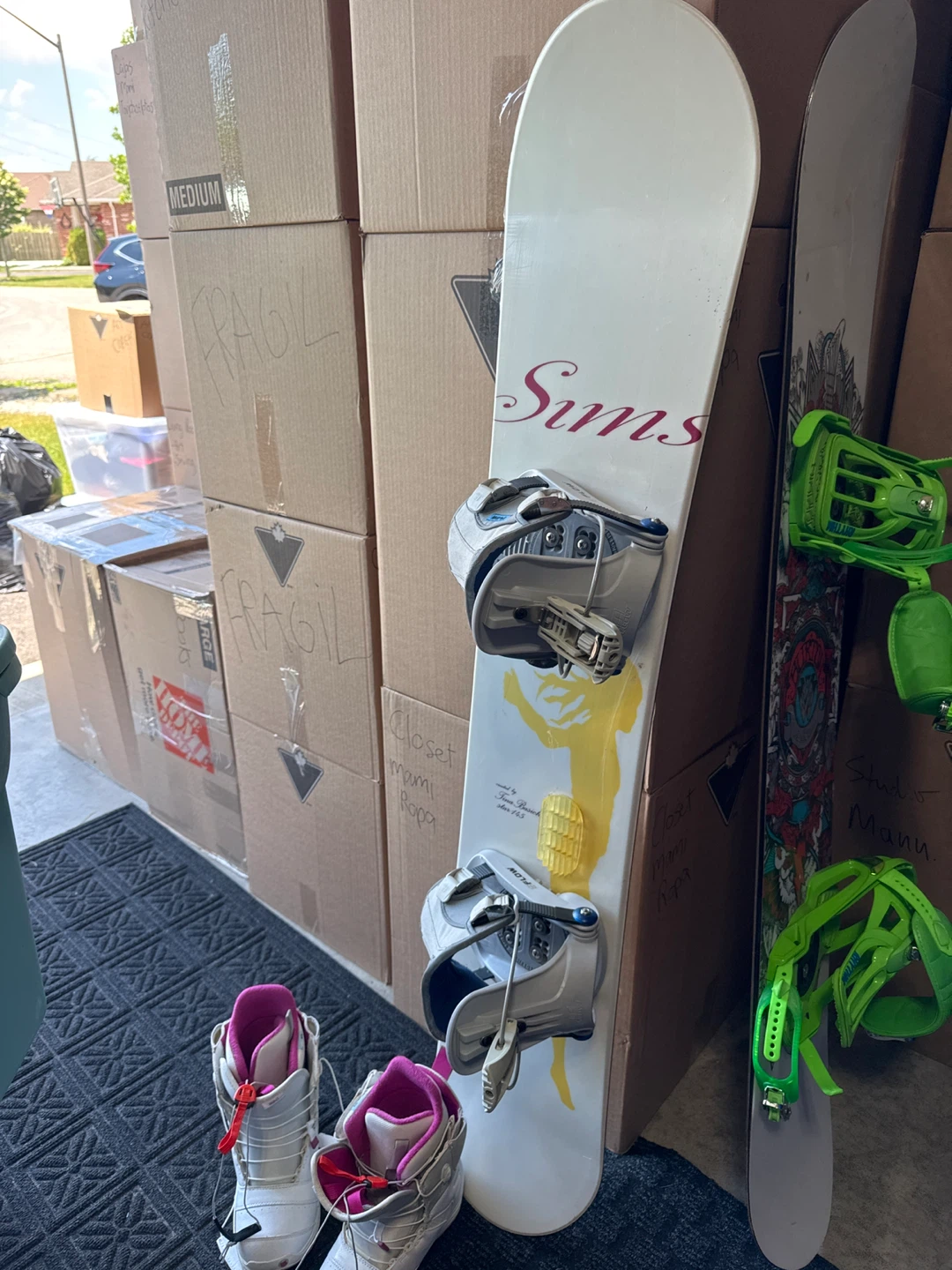 Sims Snowboard with Burton Boots and googles