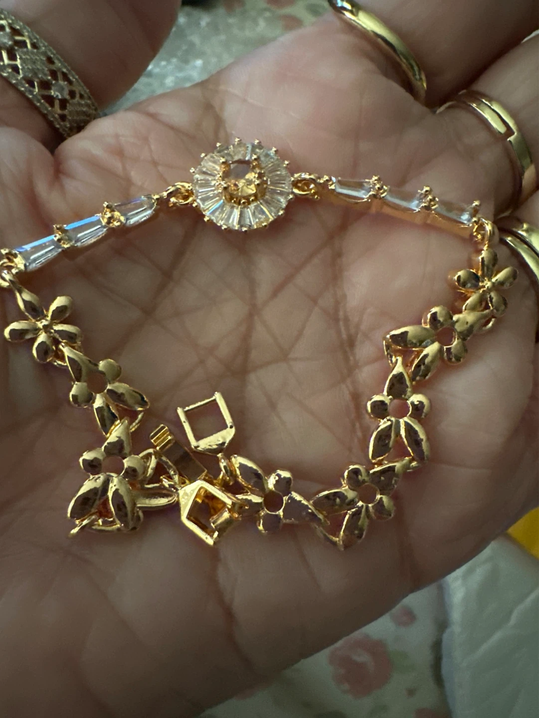 Gold tone floral and crystal bracelet