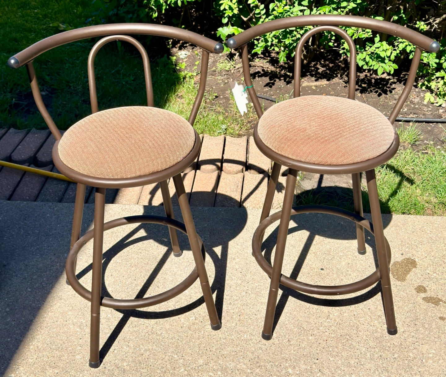 Metal Swivel Stools Distinct open-backed design. Set of 2.