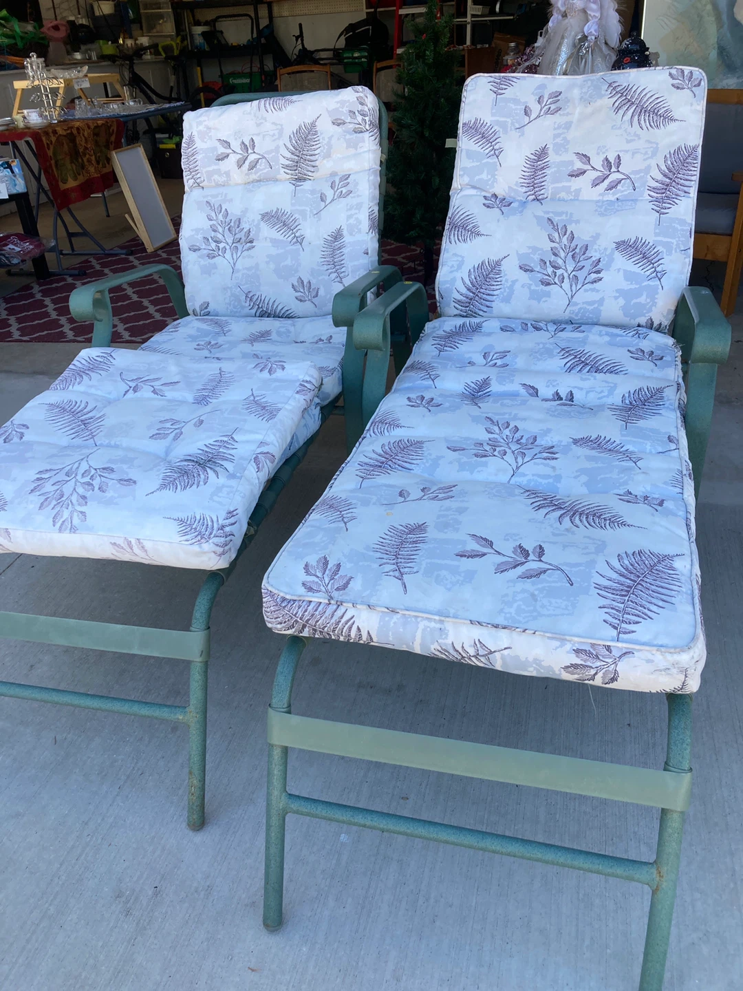 Pair of Green Patio Chaise Lounges with Fern Pattern Cushions