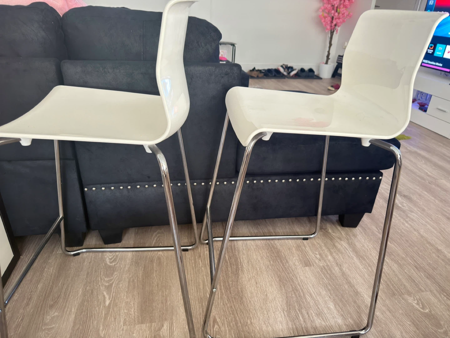 Two white bar stools