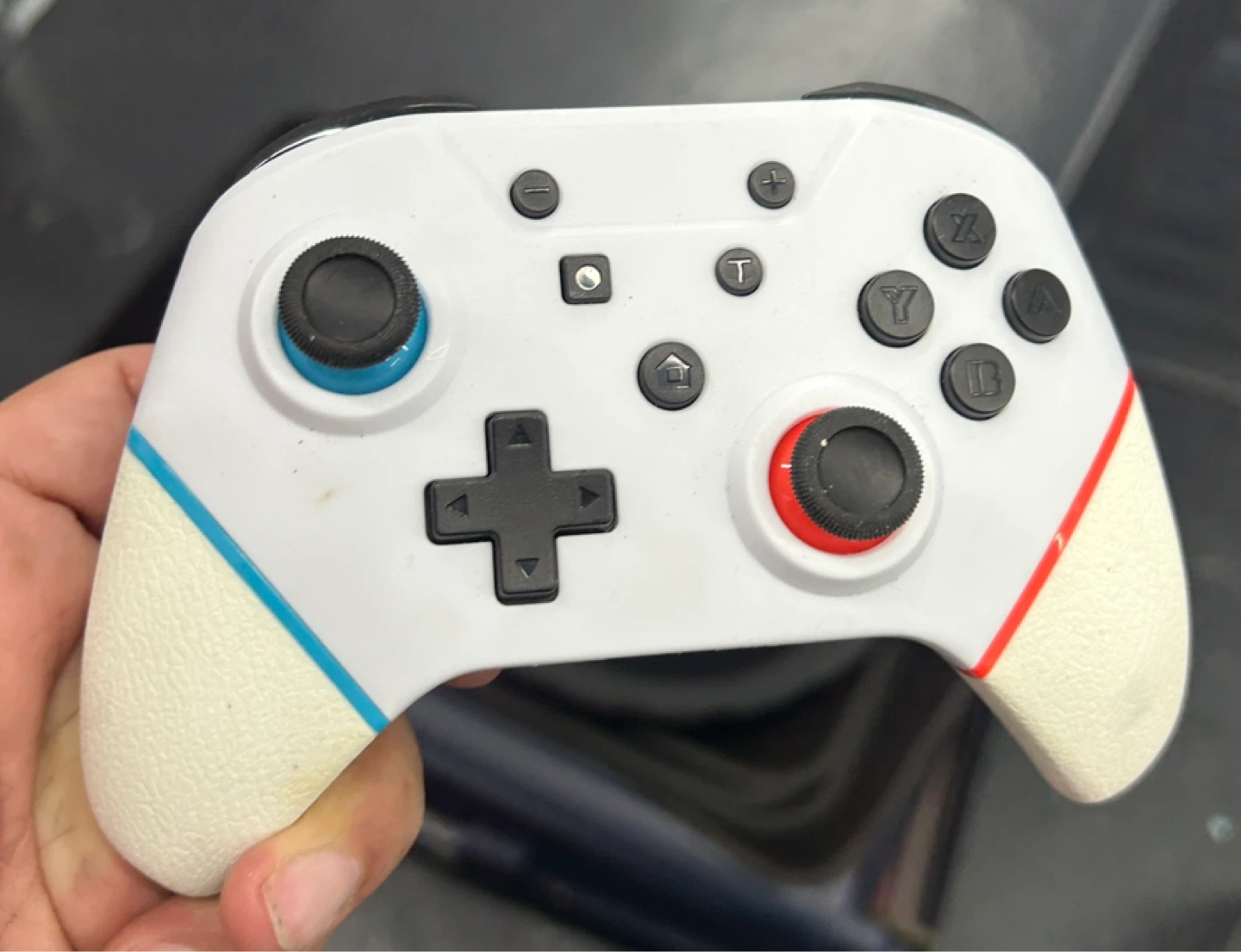 White Game Controller with Blue and Red Accents