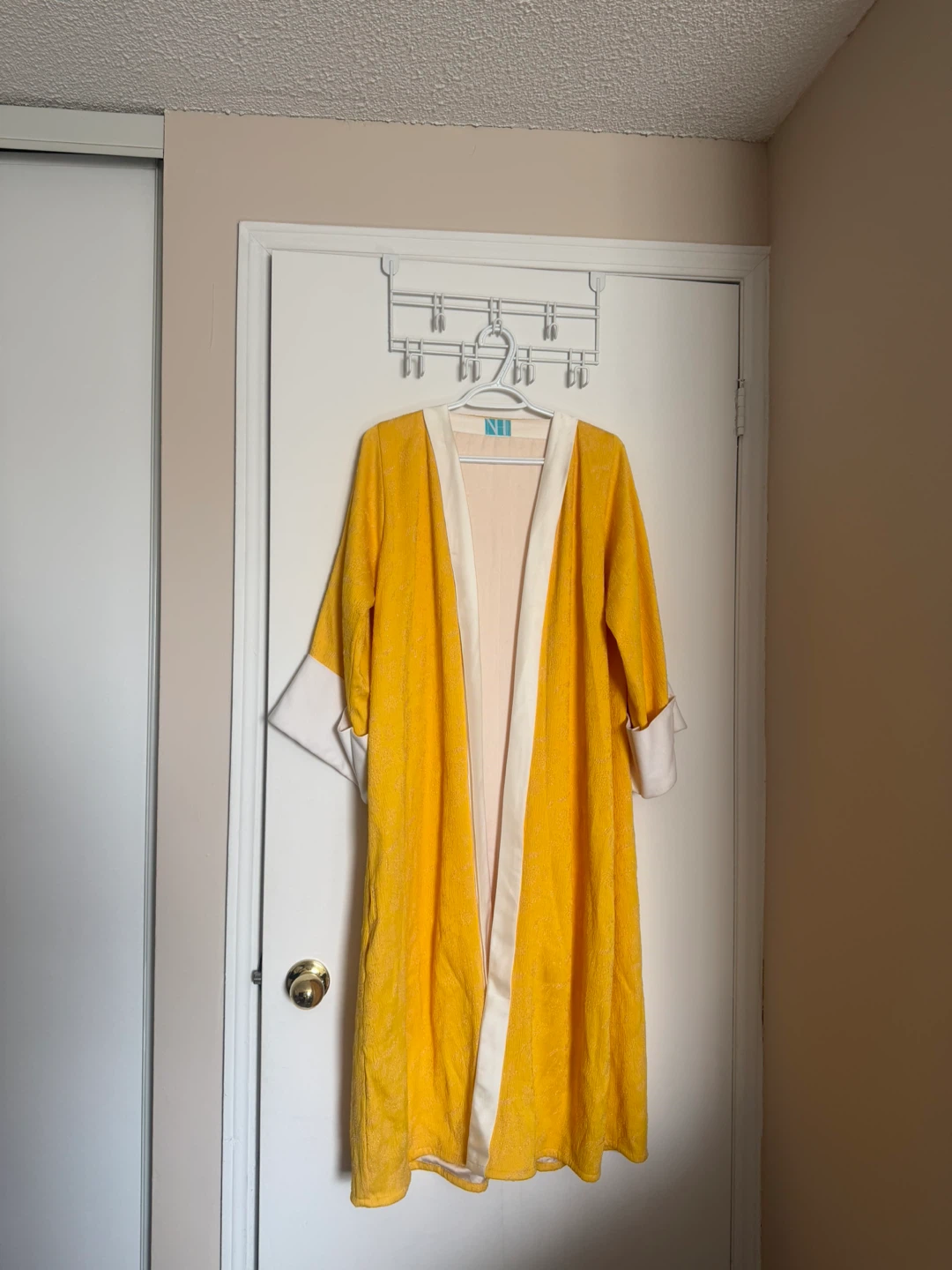 Yellow abaya/cardigan with white trim