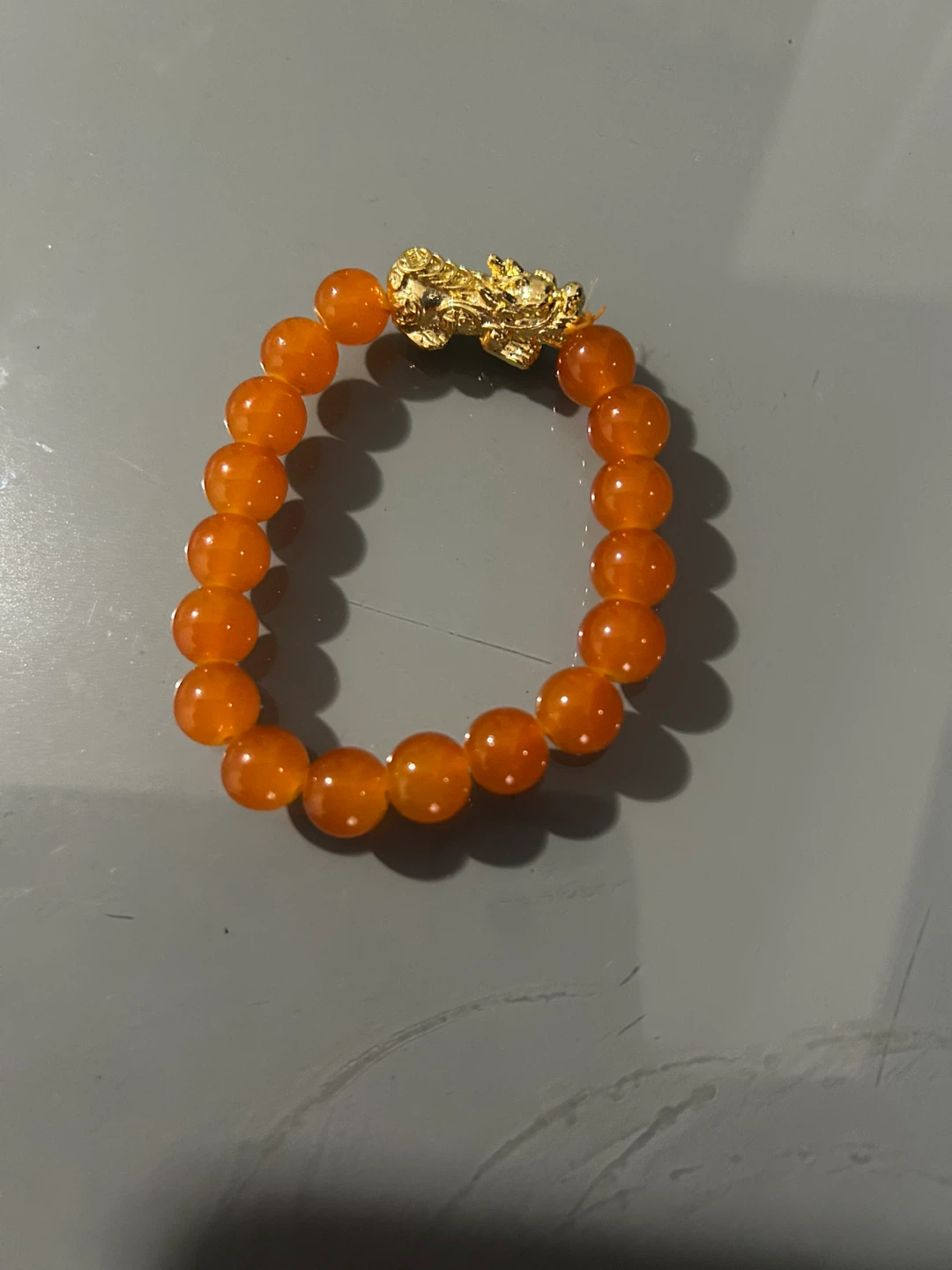 Orange Beaded Bracelet with Gold Dragon Clasp