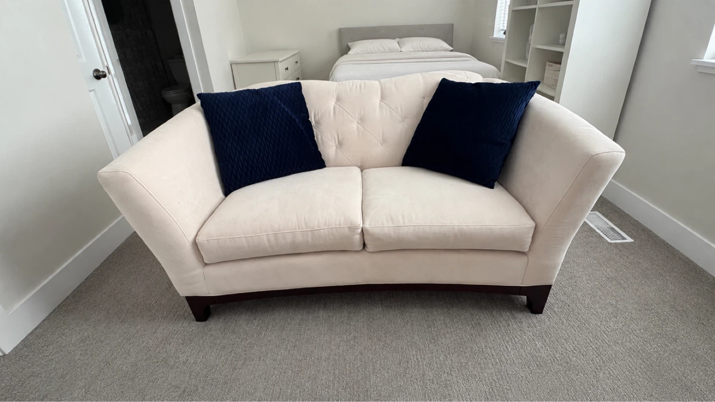 Cream Loveseat Sofa with Navy Pillows