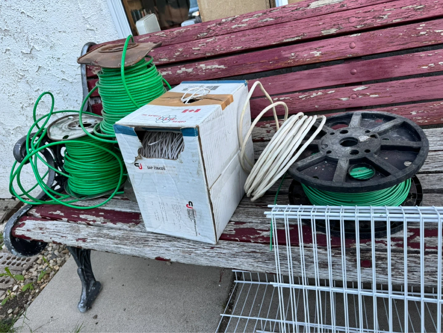 Assorted Spools of Wire and White Wire Basket