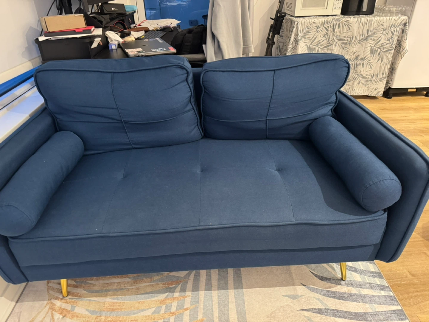 Blue 2-seater sofa with gold legs and one chair