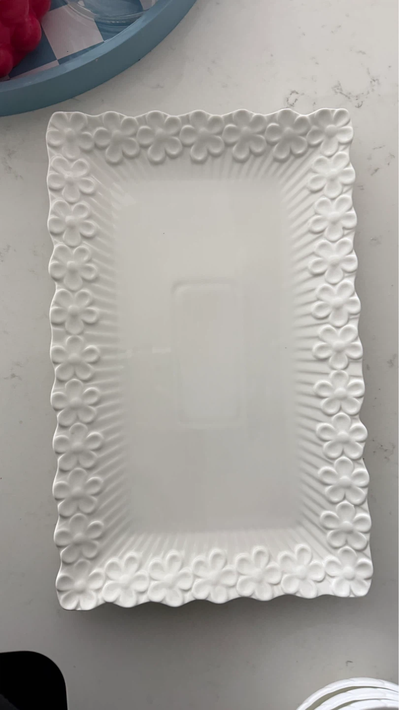 White serving platter with floral border. serving plates