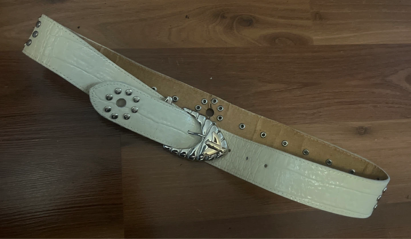 White embossed belt with ornate buckle