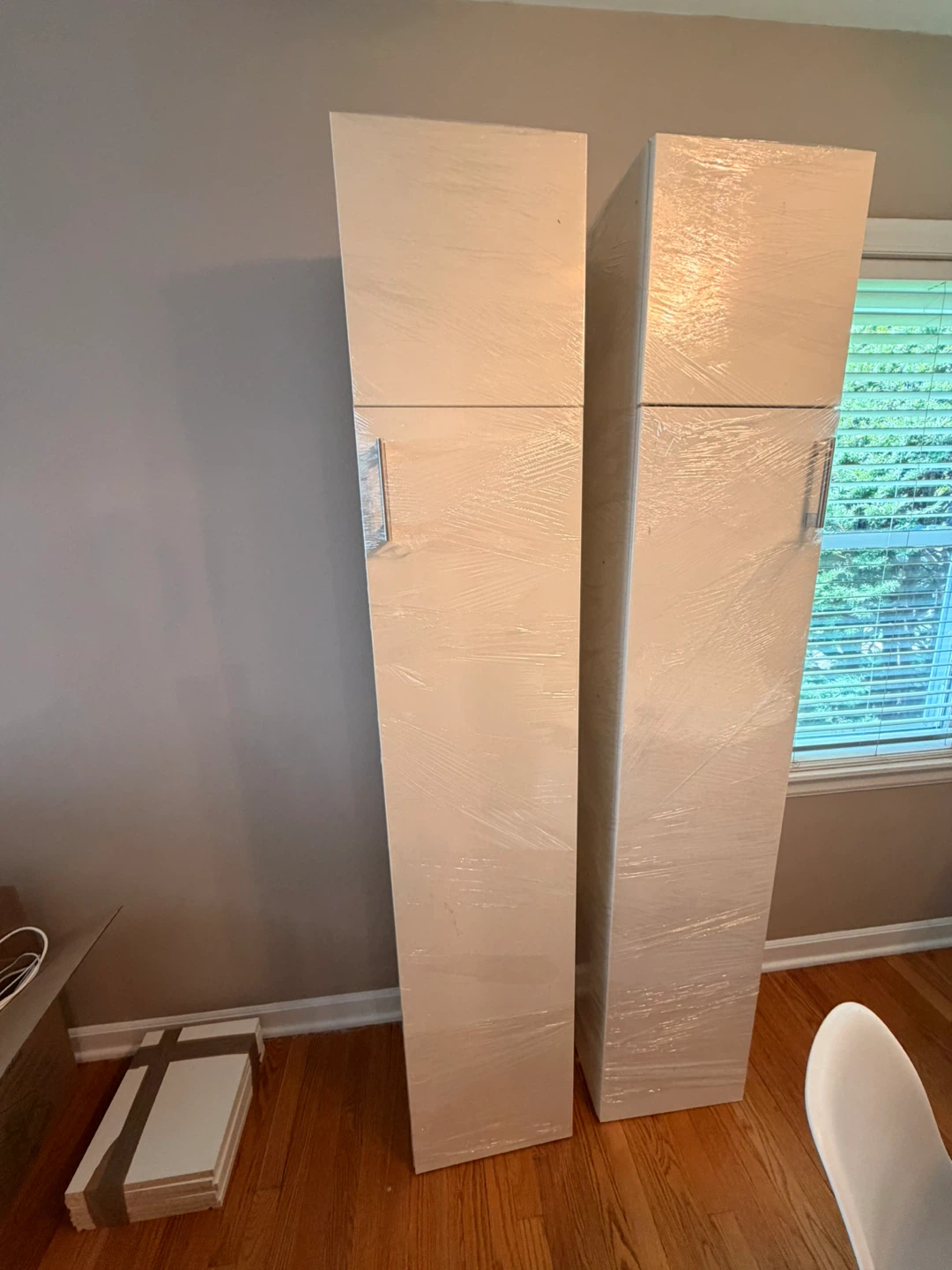 Pair of tall white cabinets