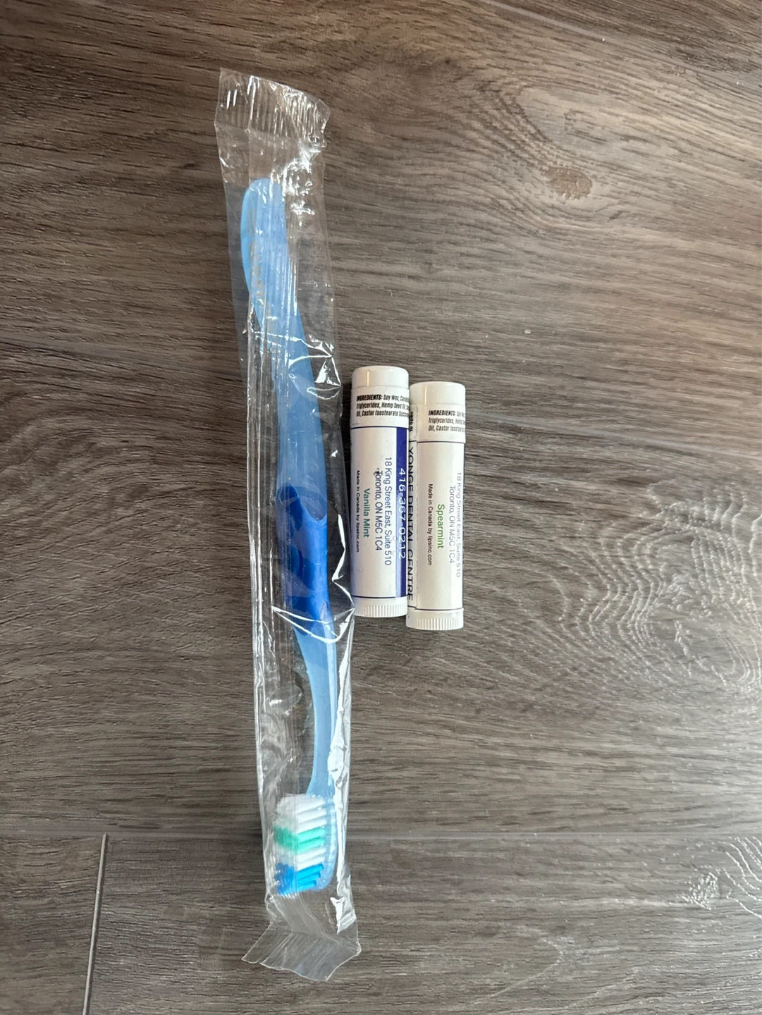 Sealed toothbrush and 2 lip balms by lipsinc