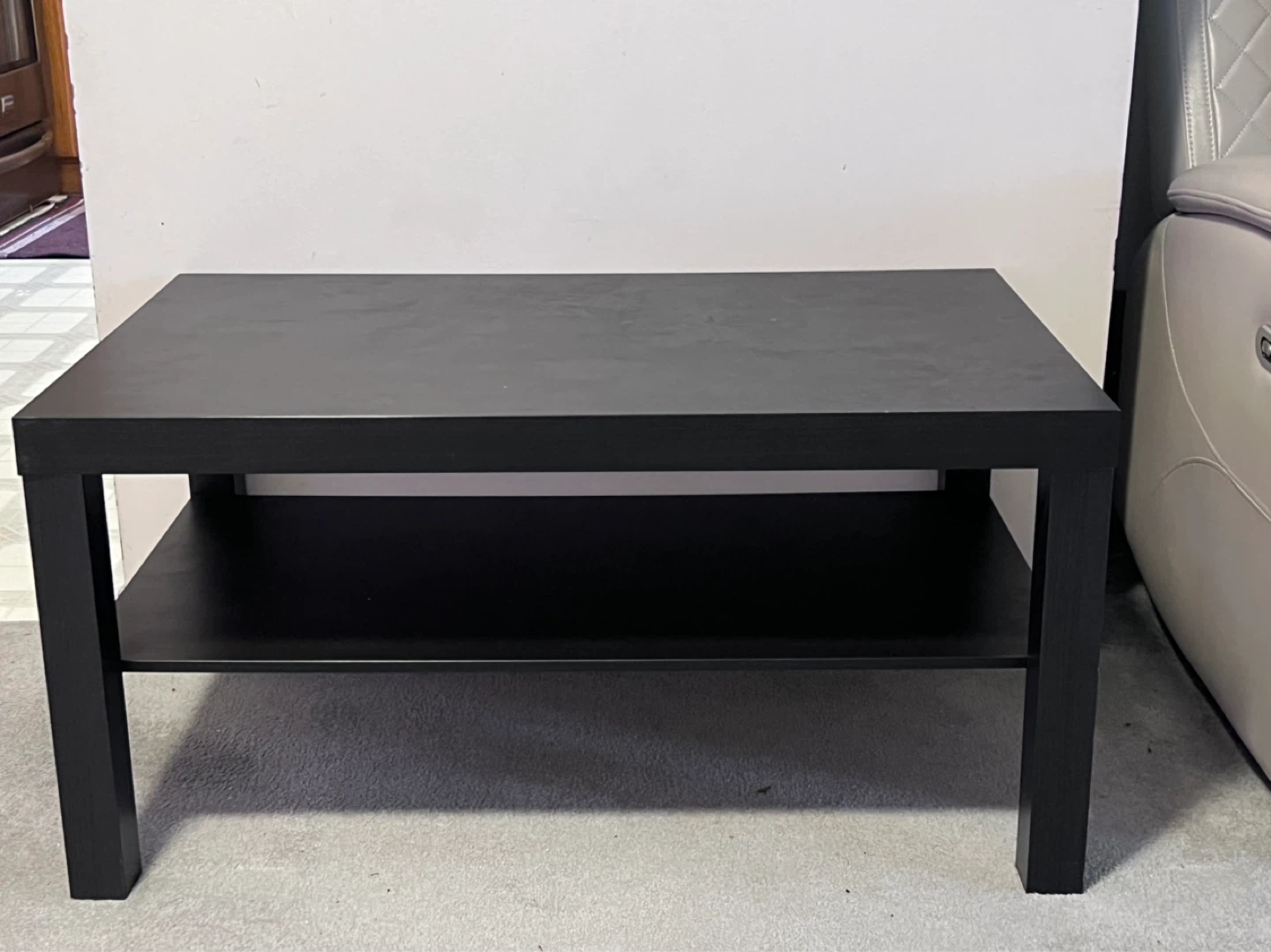 Black coffee table with shelf