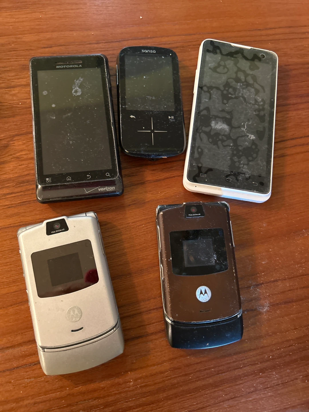 Assorted Motorola & Sansa Mobile Phones