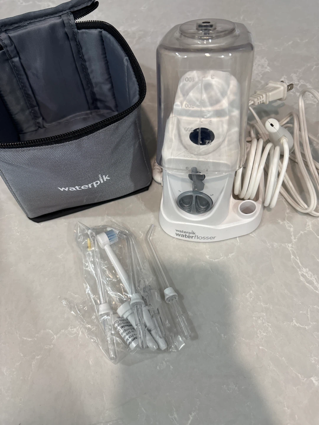 Waterpik Water Flosser with Travel Case and Accessories