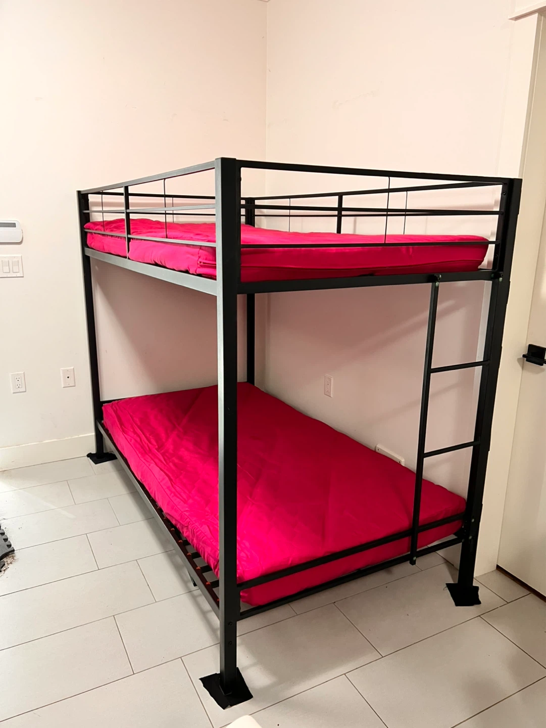 Black Metal Bunk Bed with Pink Mattresses