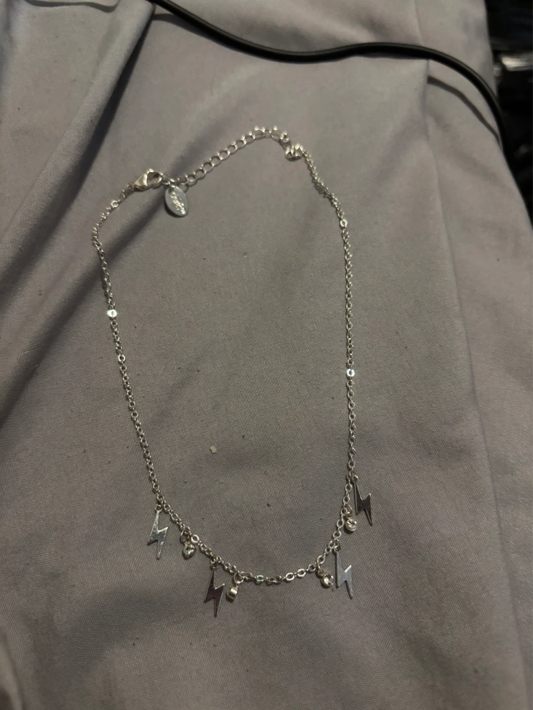 Silver-tone necklace with lightning bolt charms