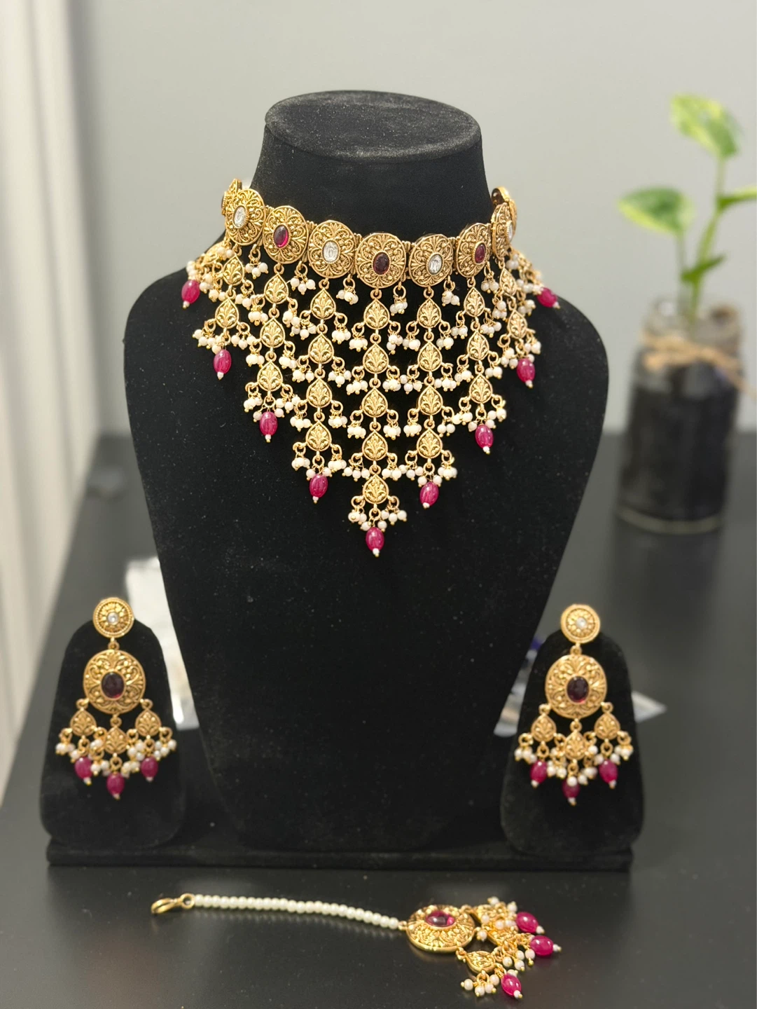 Gold coloured waterfall necklace, earring and tikka