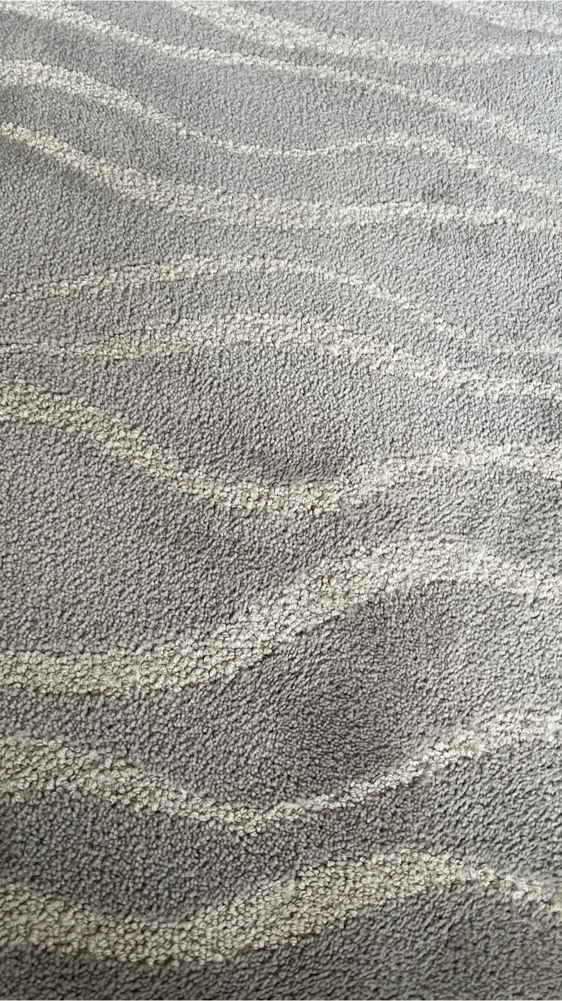 Grey wave pattern area rug