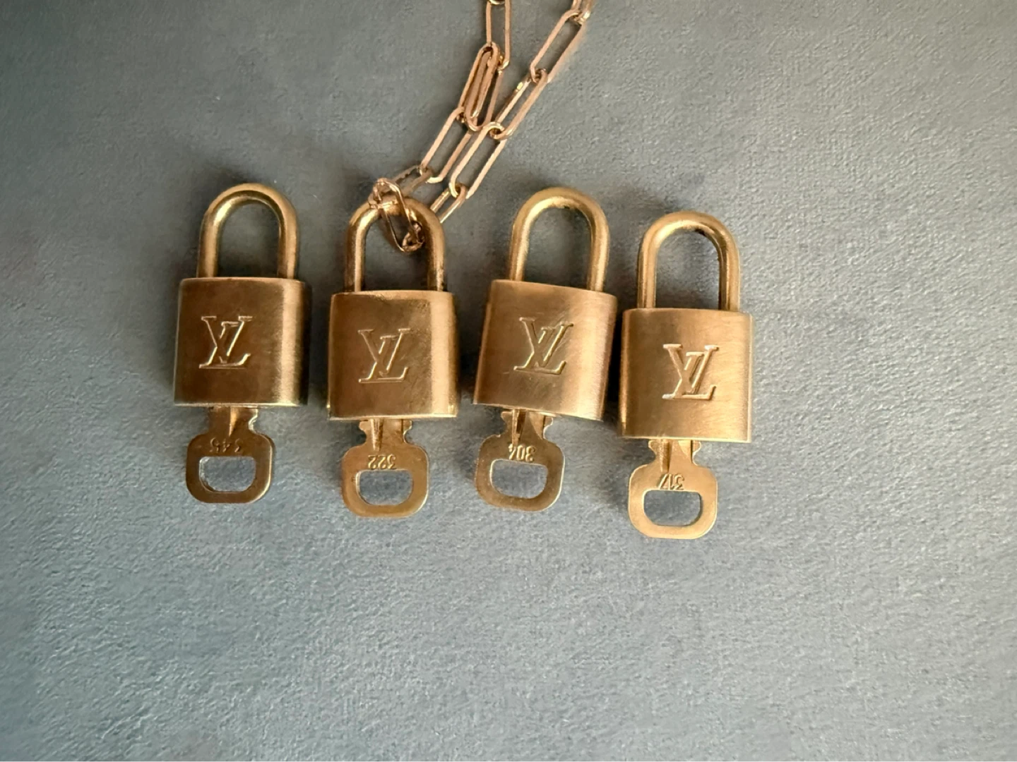 Set of 4 Louis Vuitton Padlocks with Keys