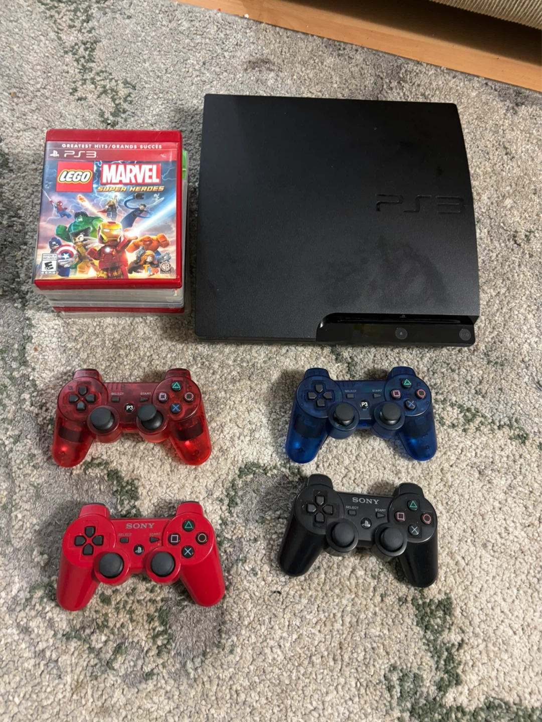 Playstation 3 console with games and controllers