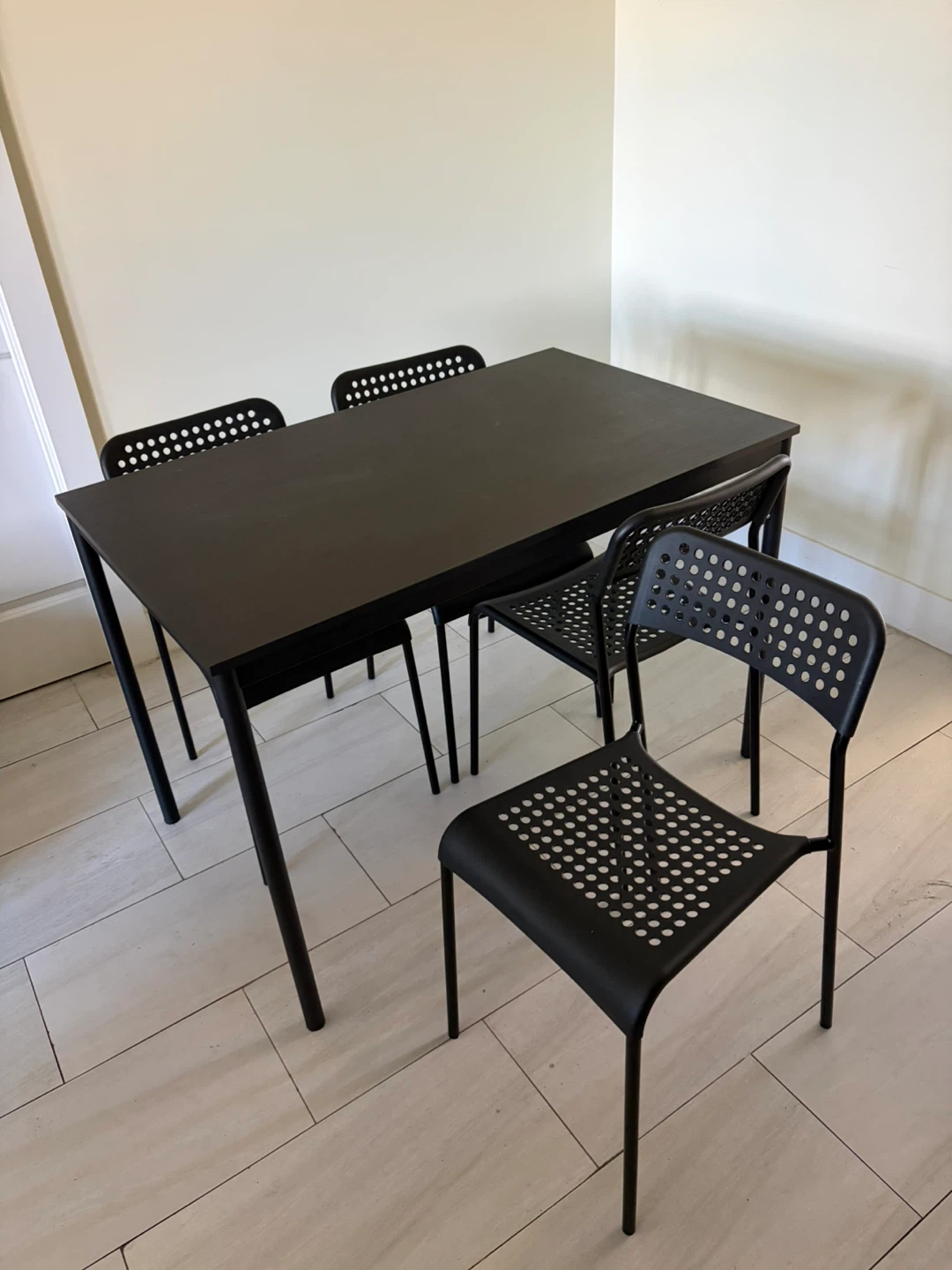 IKEA black dining table with 4 chairs
