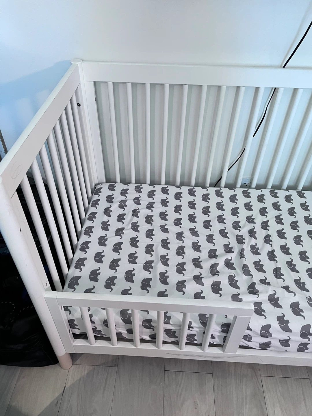White Toddler Bed with Elephant Print Sheet