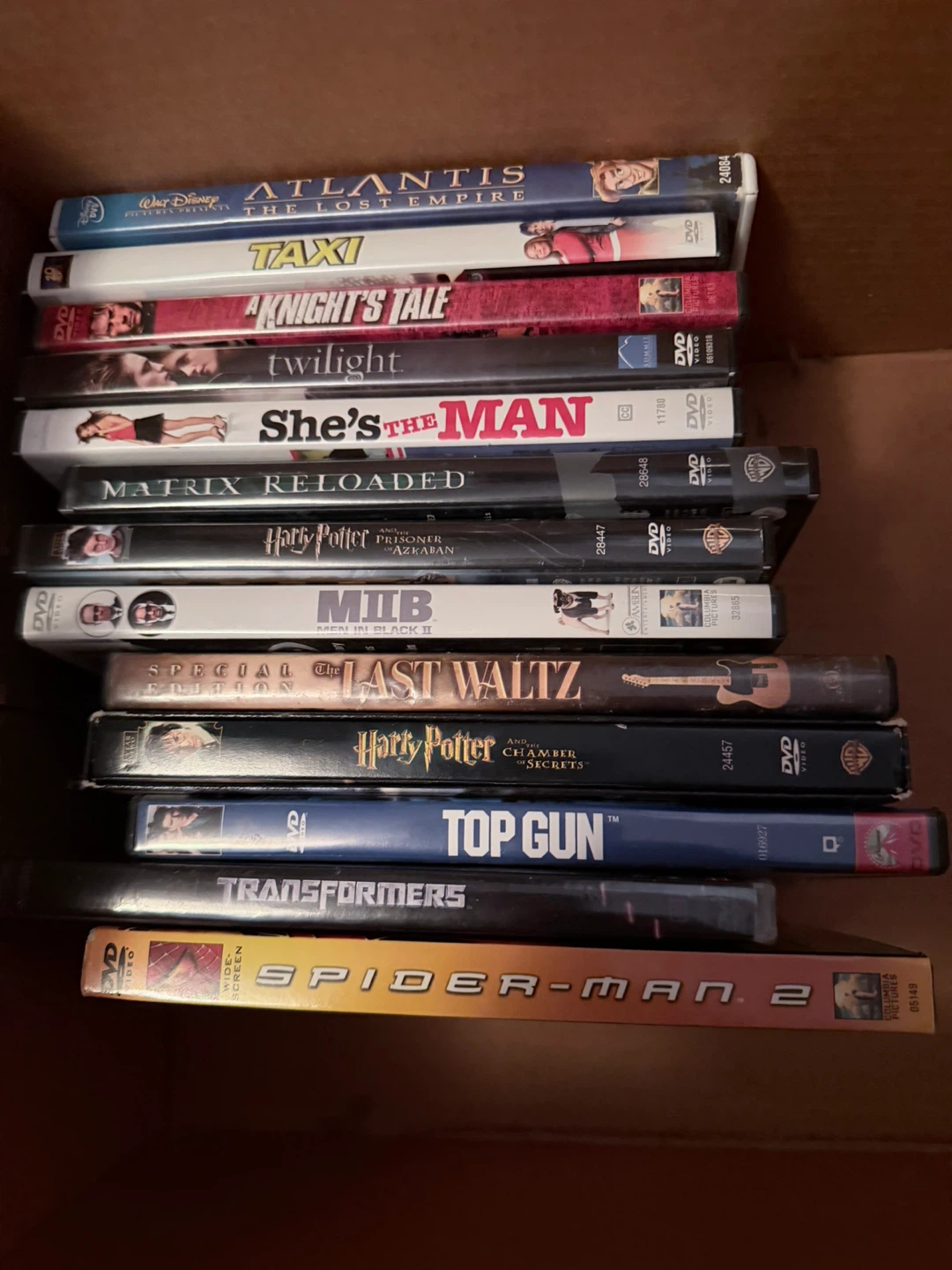 Collection of 11 DVDs: Atlantis, Taxi, Transformers & More