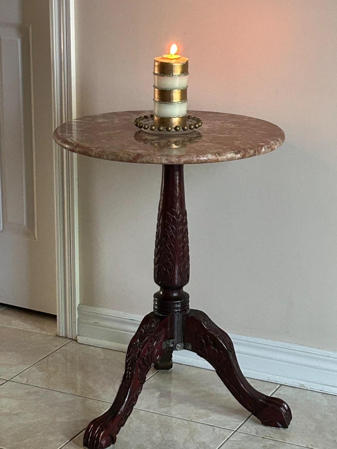 Marble top accent table with carved wooden base